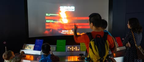 Hong Kong Space Museum featuring interior views as well as a family